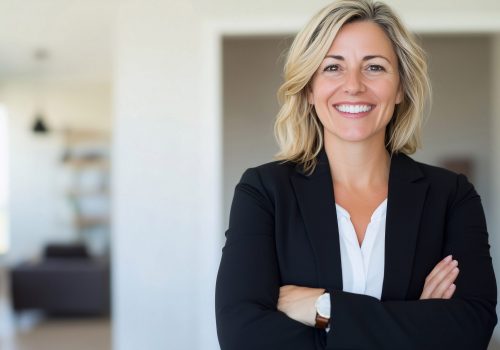 a happy and successful female realtor, businesswoman and real estate agent presents a new home or office. Her role as a consultant highlights expertise in the real estate market.